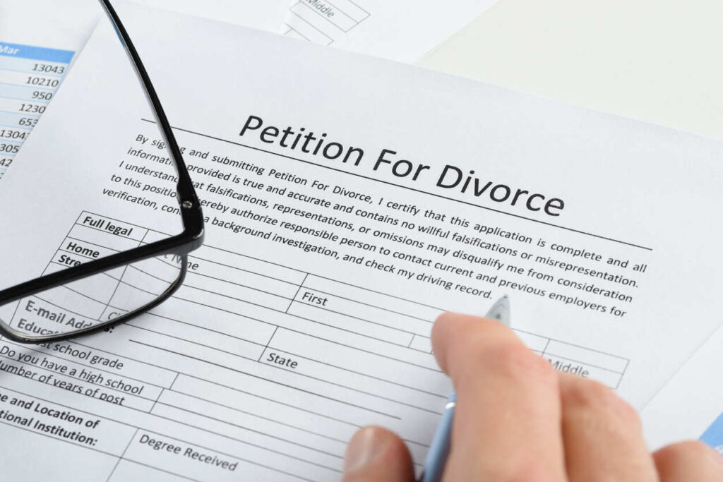 person checking divorce law form