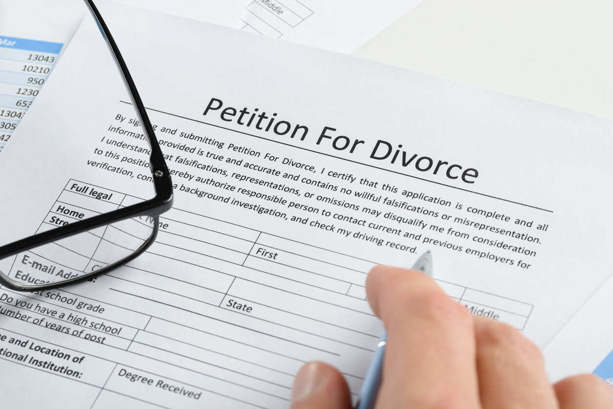 person checking divorce law form